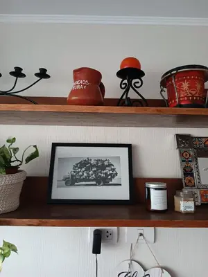 a shelf with a picture of a car on it at Acogedor y cómodo departamento de 2 Habitaciones en Magdalena in Lima