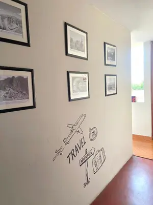 a wall with drawings on a wall with pictures on it at Cuzco Lodgement in Lima