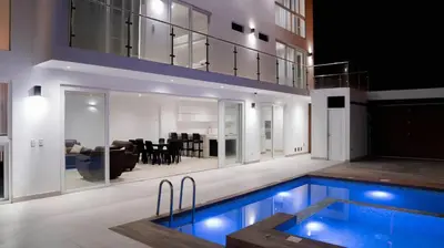 a house with a swimming pool and a living room at CA4 - Casa con Jacuzzi privado - Playa Pulpos in Punta Hermosa