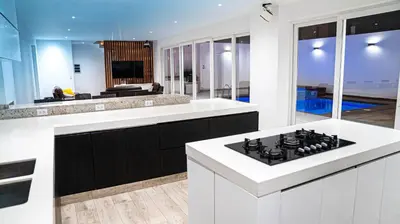 a kitchen with white counters and a stove top oven at CA4 - Casa con Jacuzzi privado - Playa Pulpos in Punta Hermosa