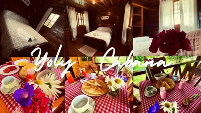 a room with a table with flowers on it at Yoly cabaña in Oxapampa