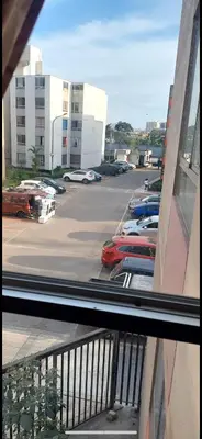 a view from a window of a parking lot at Confort Maruja in Lima