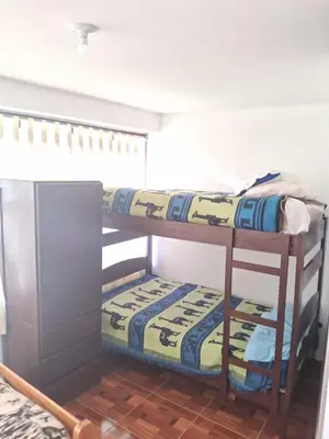 two bunk beds in a small room with at Guest House Aylluq Wasin in Urubamba