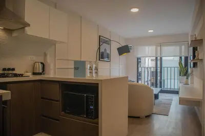 a kitchen with a counter with a microwave at Art by Wynwood House in Lima
