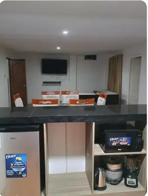 a kitchen with a counter top with boxes on it at Departamento Acogedor en Surco in Lima