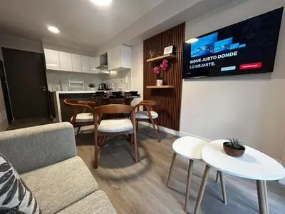 a living room with a couch and a table at Brand new apartment in Miraflores in Lima