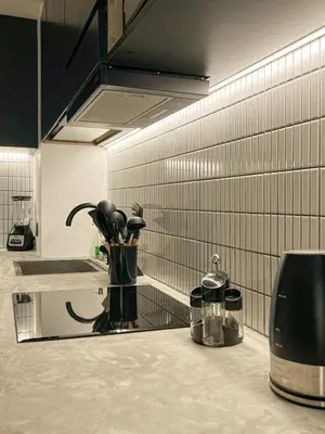 a kitchen with a counter with a vase on it at Barranco Breeze Loft Apartments by Geko in Lima