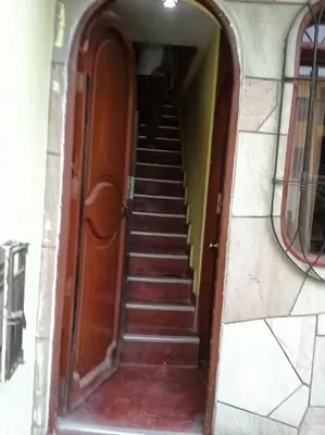 a staircase in a building with a stairway leading into a hallway at Modern Apartmen Furnished in Lima Near the Airport in Lima