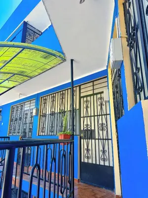 a view of the front doors of a building at Departamento completo cerca de la Plaza ,cocina equipada y vista a la ciudad in Ayacucho