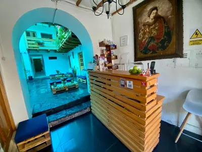 a room with a counter and a painting on the wall at Hotel Panaka II in Cusco