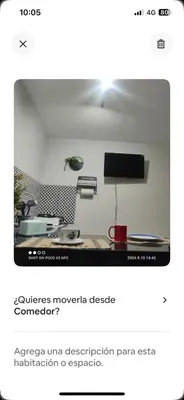 a screenshot of a room with a desk and a tv at Minidepa Ecléctico in Lima