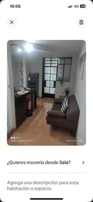 a living room with a couch and a desk at Minidepa Ecléctico in Lima