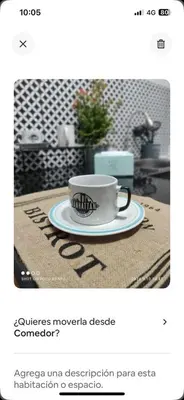 a coffee cup sitting on top of a table at Minidepa Ecléctico in Lima