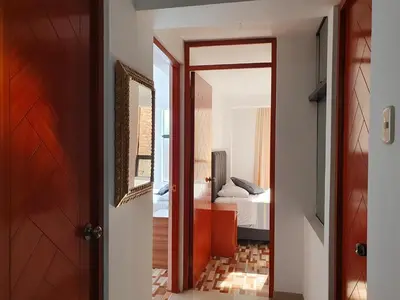 a hallway with a door leading to a bedroom at Your 2nd home in residential area in Cusco