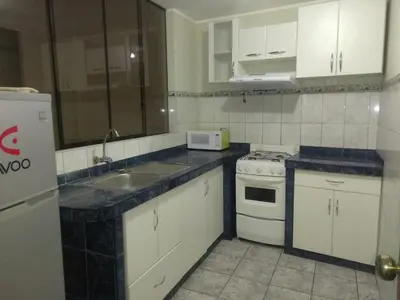 a kitchen with a sink and a stove top oven at New Apartment furnished in Lima - Near the Airport in Lima