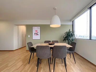 a dining room with a table and chairs at Sky Flatt 2BR by Geko in Lima