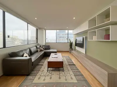 a living room with a couch and a coffee table at Sky Flatt 2BR by Geko in Lima