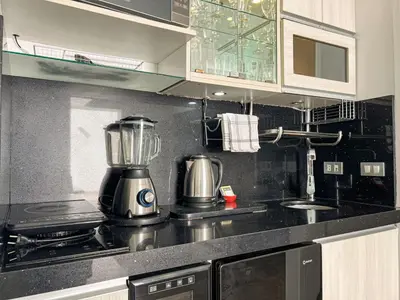 a kitchen with a blender on top of a counter at The Snake 1BR by Geko in Lima