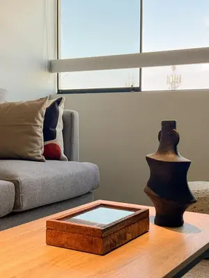 a living room with a couch and a coffee table at Coco 3BR by Geko in Lima