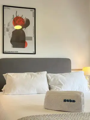 a bedroom with a bed with a picture on the wall at Barranco Sailor Apartment by Geko in Lima