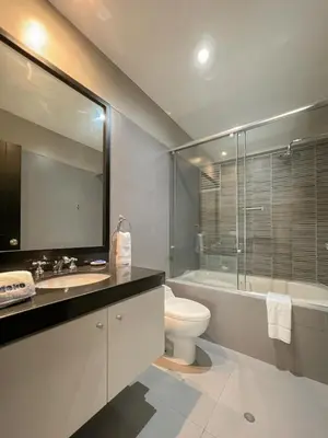 a bathroom with a toilet and a sink and a shower at Barranco Sailor Apartment by Geko in Lima