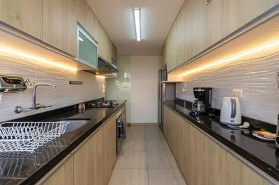 a kitchen with a sink and a counter top at Caoba 3BR by Geko in Lima