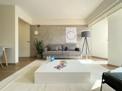 a living room with a couch and a coffee table at Syberia 2BR by Geko in Lima