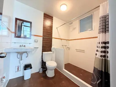 a bathroom with a toilet and a sink and a shower at Hospedaje Turístico - Kantu Inn in Ollantaytambo