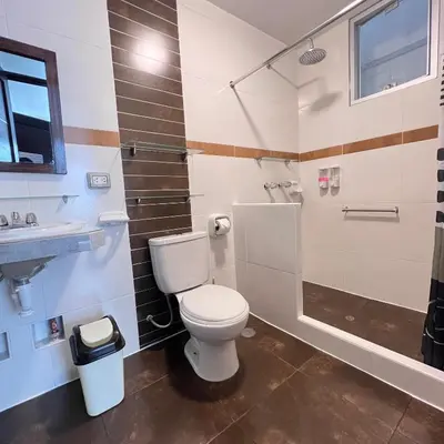 a bathroom with a toilet and a shower and a sink at Hospedaje Turístico - Kantu Inn in Ollantaytambo