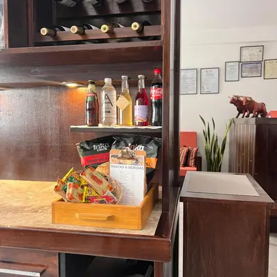 a counter with several bottles of coca cola at Hospedaje Turístico - Kantu Inn in Ollantaytambo