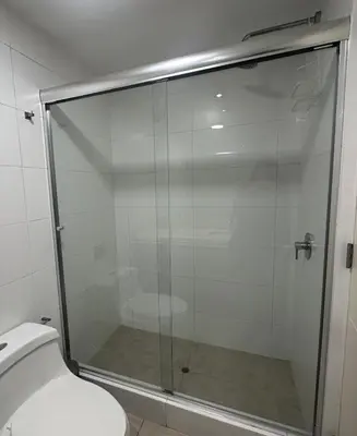 a glass shower in a bathroom with a toilet at Pardo Miraflores Apartment - Aparts 4 Days in Lima