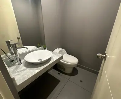 a bathroom with a white toilet and a sink at Pardo Miraflores Apartment - Aparts 4 Days in Lima