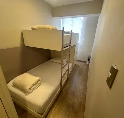 a small room with two bunk beds in it at Pardo Miraflores Apartment - Aparts 4 Days in Lima