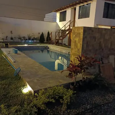 a swimming pool in the yard of a house at casa de playa en lurin con piscina y parrilla in La Planicie