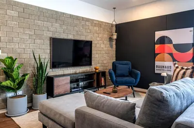 a living room with a couch and a tv at Dubrovnik 2BR by Geko in Lima