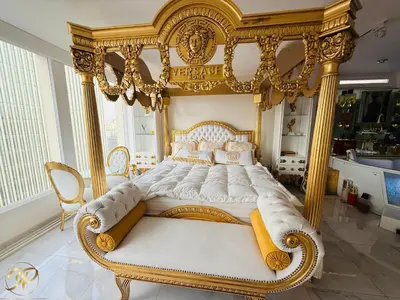 a bedroom with an ornate bed in a room at El Palacio del Rey in Lima