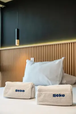 two towels sitting on top of a bed at Vince City 1BR by Geko in Lima