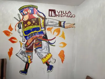 a painting of a man doing a karate kick at Villa Hidalgo - Centro Vacacional in Pazos
