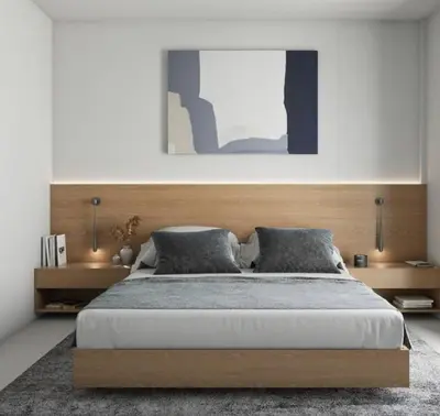 a bedroom with a large bed with a wooden headboard at Depa in Lima