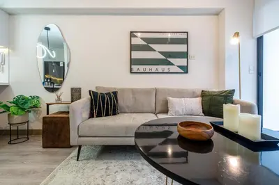 a living room with a couch and a table at Audiencia by Geko in Lima