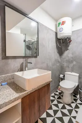 a bathroom with a sink and a toilet at Zebbra 1BR by Geko in Lima