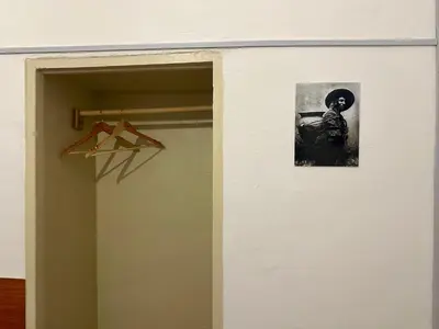a door to a room with a picture of a person at Posada Escondida in Cusco