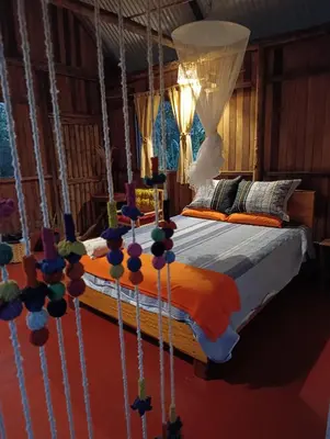 a bedroom with a bed in a room at Bella Victoria Ecolodge in Santa María