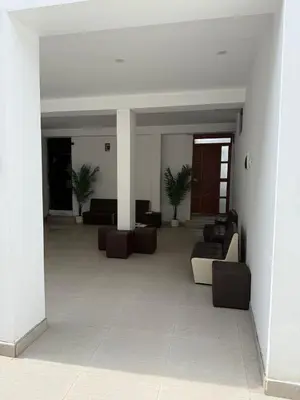 a living room with couches and chairs in a building at Loft and reception RISHEL in Chincha