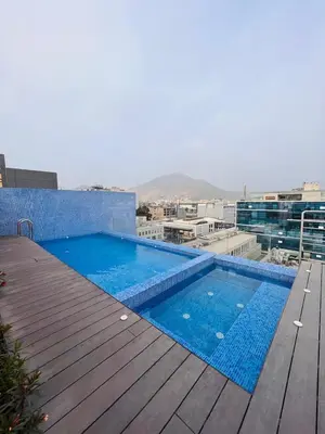a swimming pool on the roof of a building at Monterrico Polo Aparts #22- Dpto 2 Dorm 2 baños - Frente Embajada USA in Lima