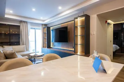 a living room with a large table and a couch at The Rooftop 2BR by Geko in Lima