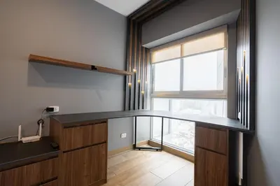 a room with a desk and a large window at The Rooftop 2BR by Geko in Lima