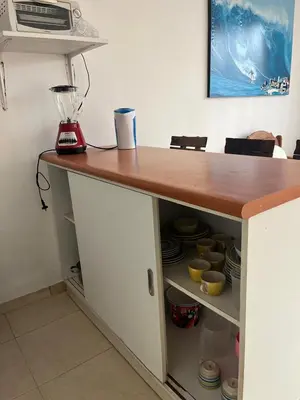 a kitchen counter with a blender on top of it at Punta Hermosa - depa Santa Cruz in Punta Hermosa