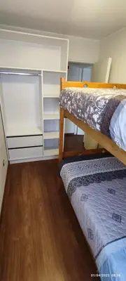 a bedroom with two bunk beds and a closet at 4 habitaciones in Lima