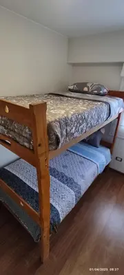 a bedroom with two bunk beds in a room at 4 habitaciones in Lima